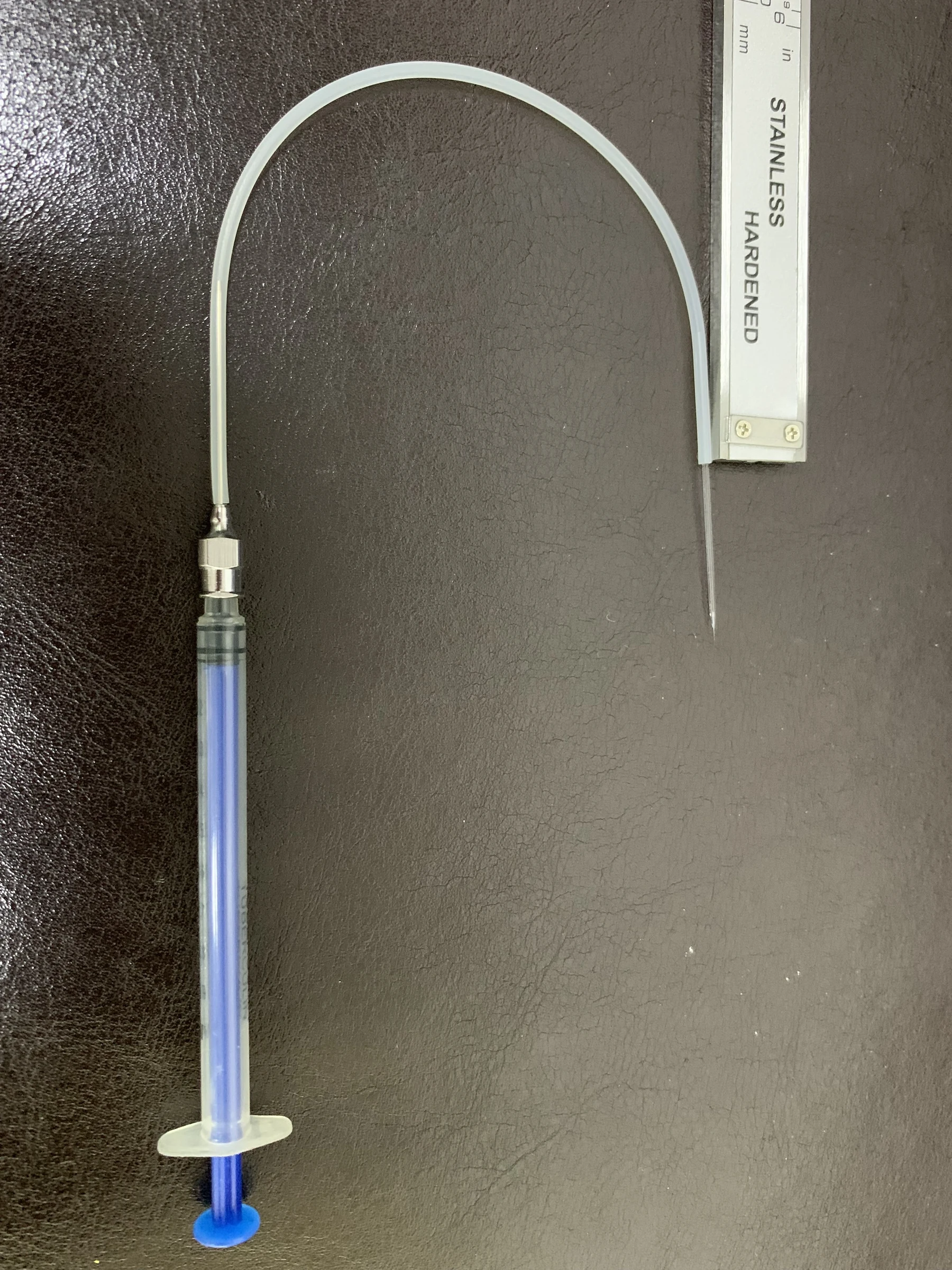 Micron-scale glass needles