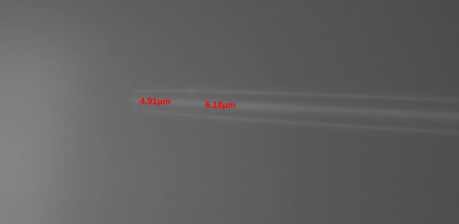 Micron-scale glass needles